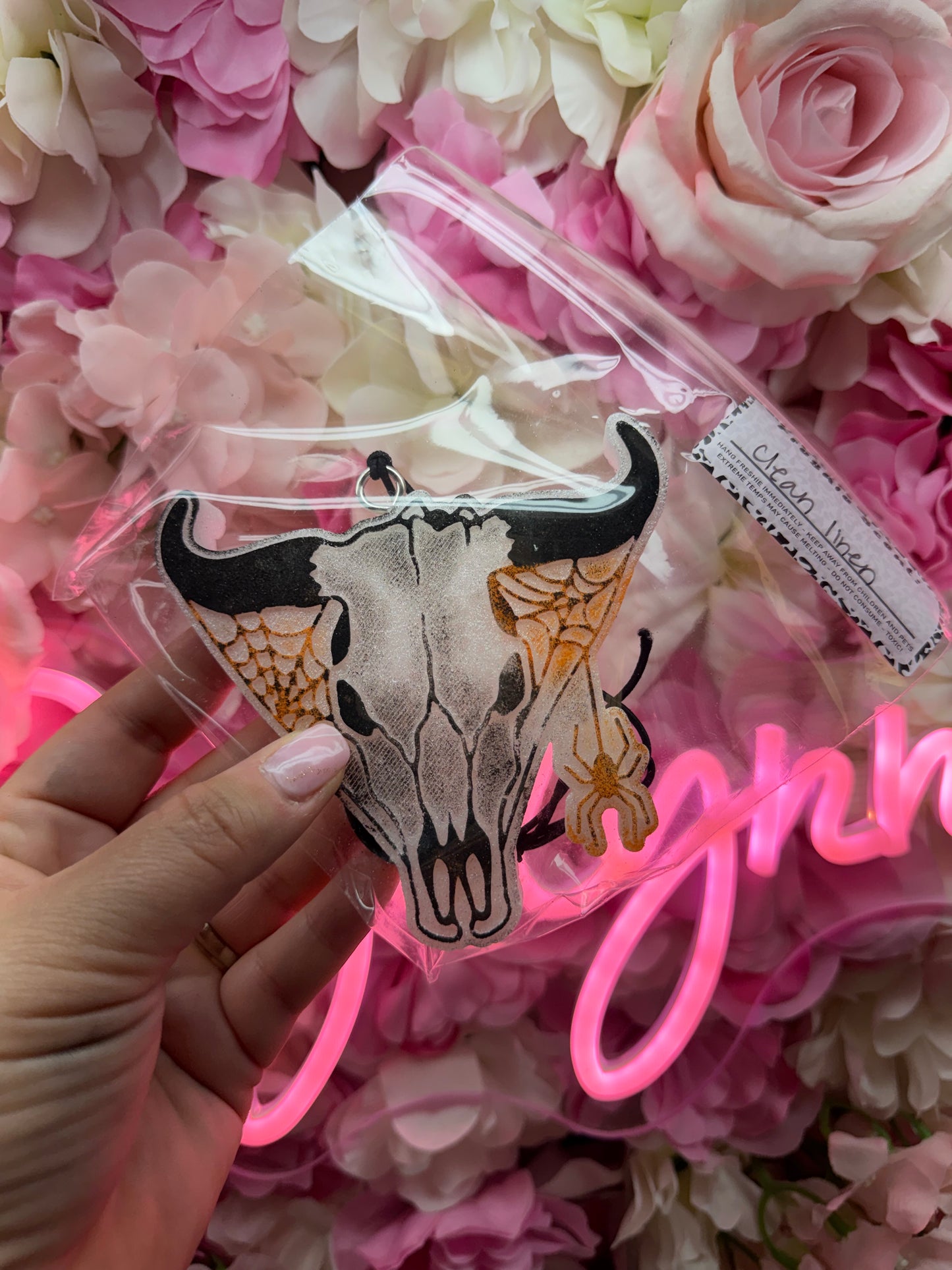 BY THE HORNS